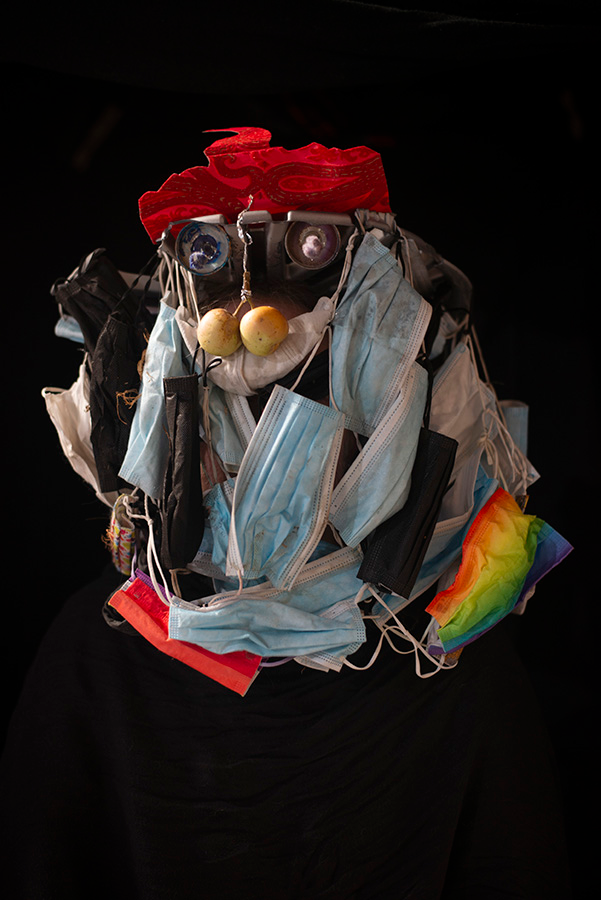 A mask predominated by a cascade of surgical masks.